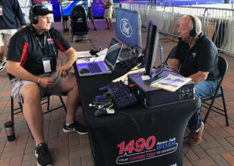 John Monnett giving one of his many media interviews during AirVenture