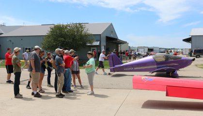 Oshkosh local Wayne Daniels pushes his Sonex "Purple Haze" out during Sunday's Sonex Open House.